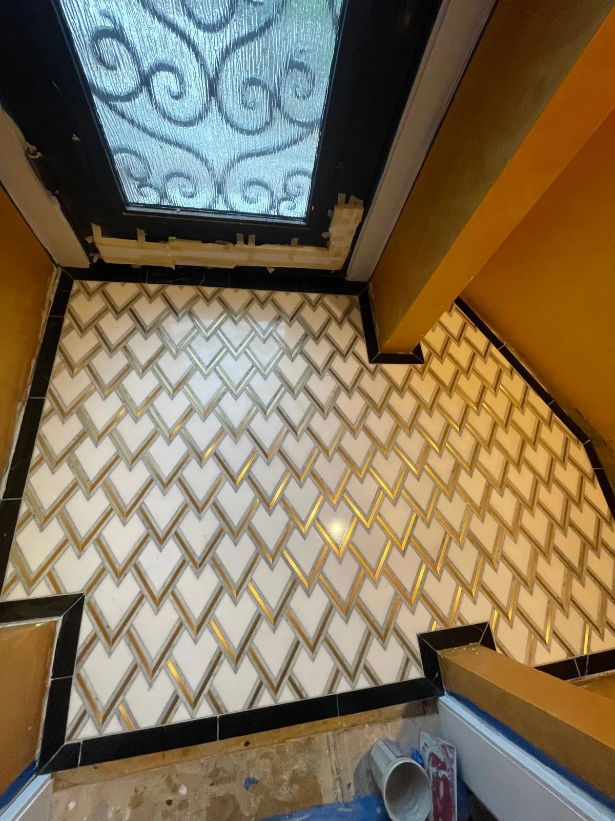 Entryway floor tiles with gold inlay